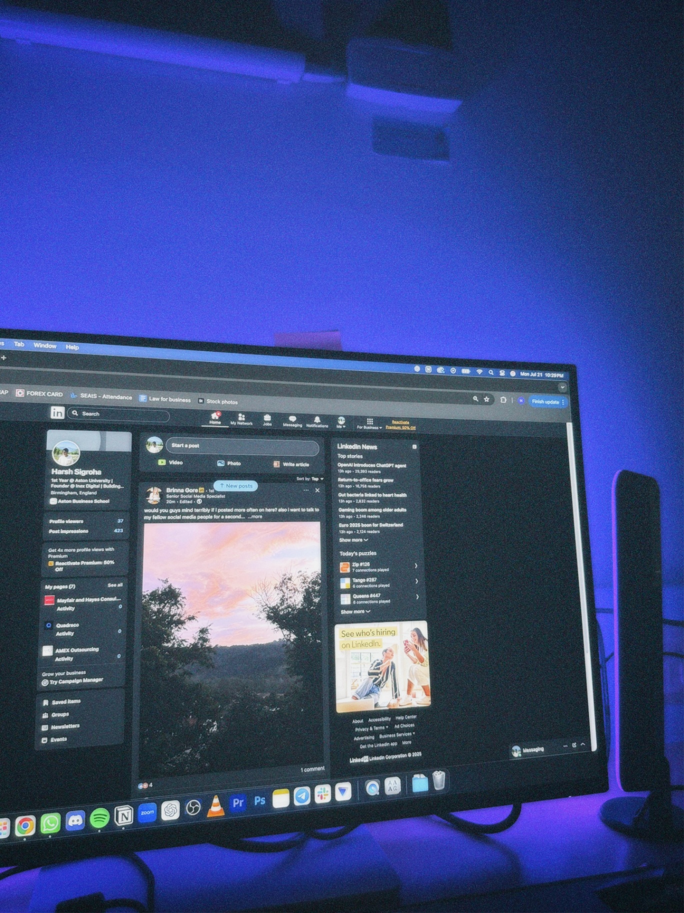 Harsh's desk at night, lit blue, with LinkedIn open on the monitor